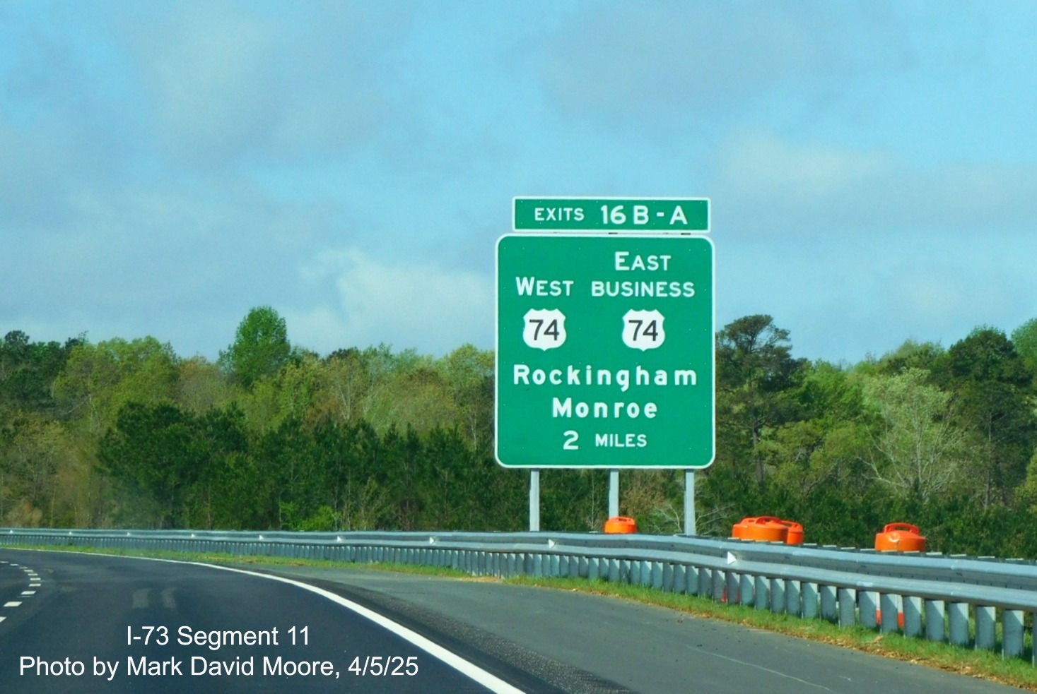 Image of 2 miles advance sign for West US 74/East Business 74 exit on I-73 South/
		I-74 East Rockingham Bypass by Mark David Moore, April 2025