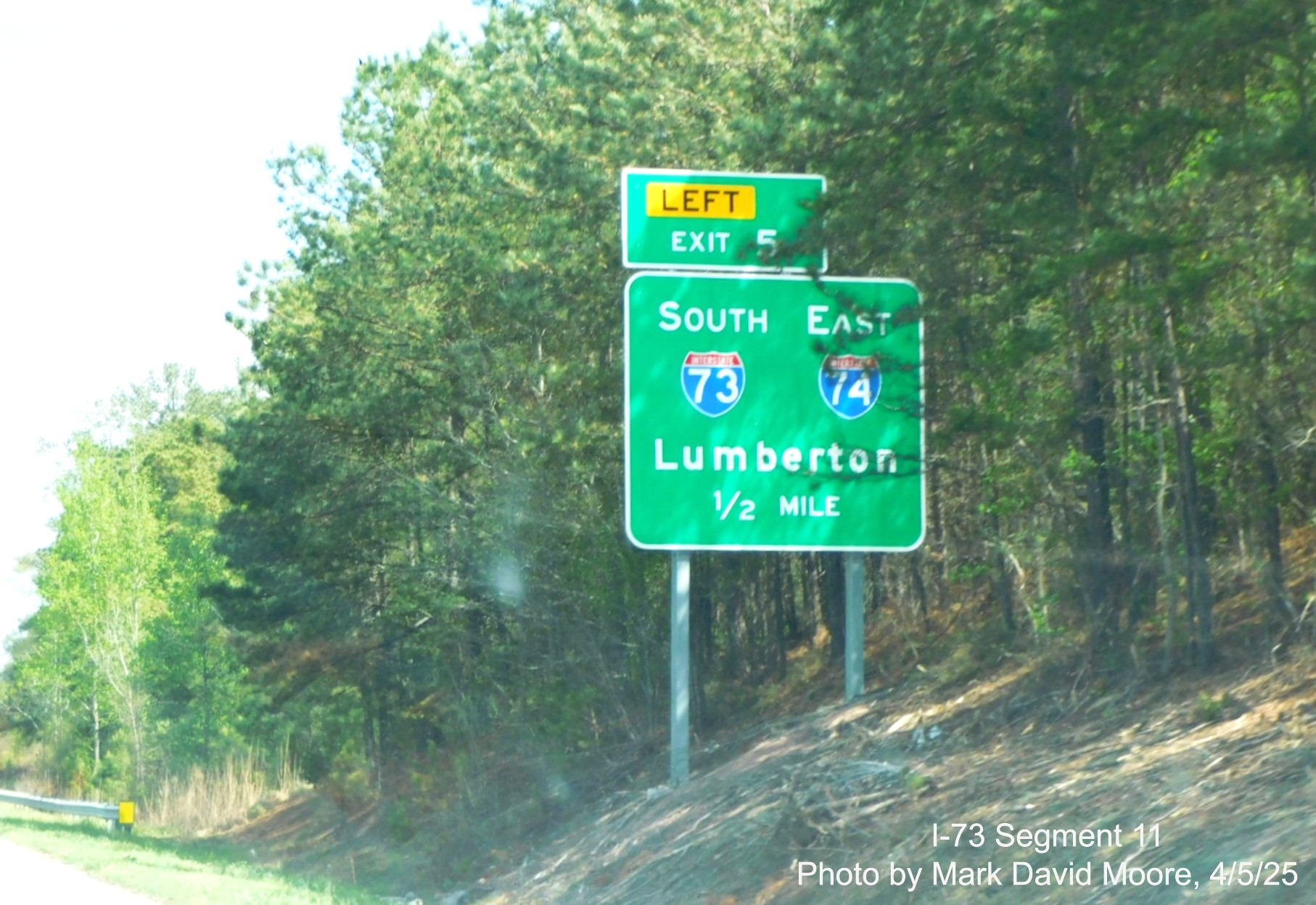 Image of ground mounted 1/2 mile advance sign for the I-73/I-74 Rockingham 
		Bypass on US 220 North by Mark David Moore, April 2025
