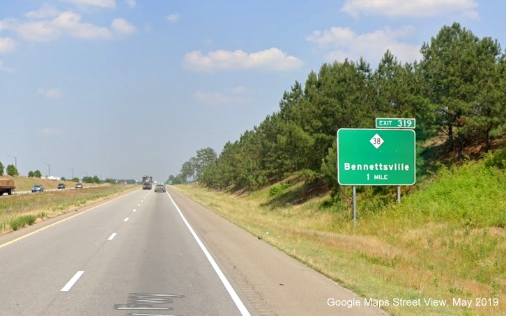 Google Maps Street View image of 1-mile advance sign for NC 38 exit with Hamlet removed 
        as destination on US 74 (Future I-73 South/I-74 East) East in Hamlet, taken in May 2019