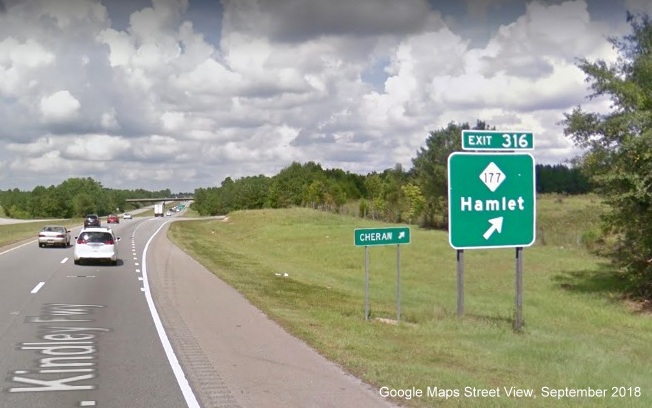 Google Maps Street View image of ground mounted ramp sign for NC 177 exit in US 74 
        (Future I-73 North/I-74 East) East in Hamlet, taken in September 2018