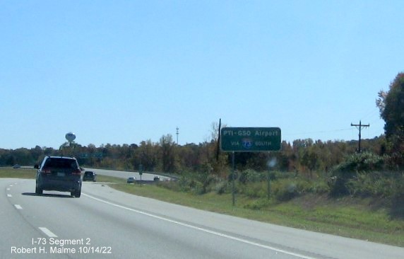 Image of auxiliary sign for PTI Airport at start of I-73 South in Rockingham County, October 2022