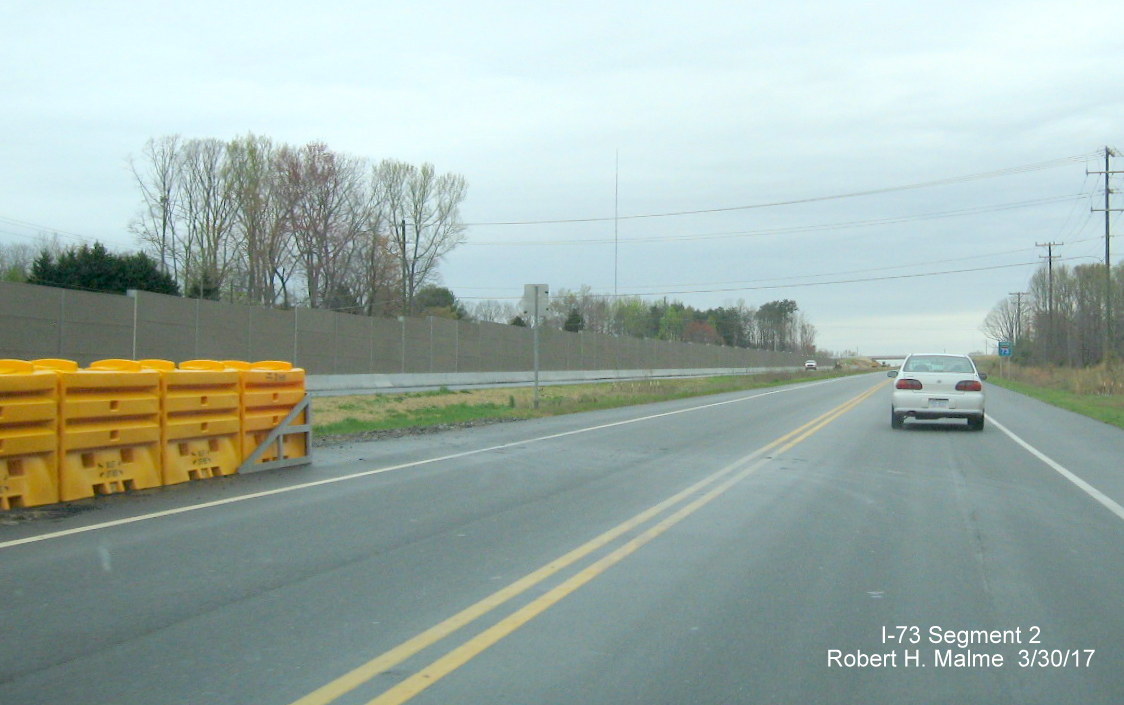 Image of northbound view along US 220 looking at newly installed sound barrier walls along Future I-73/US 220 South lanes