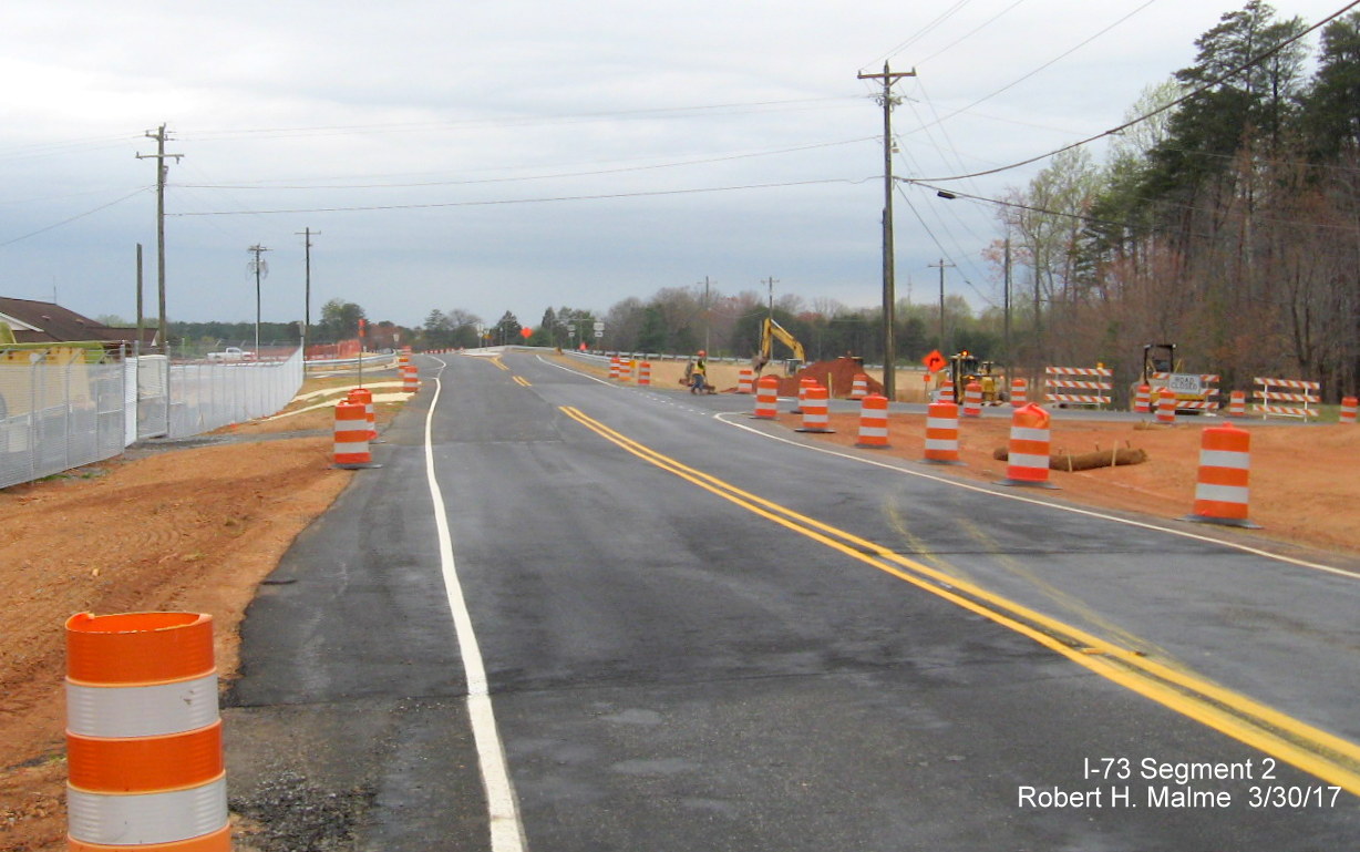 Image of view looking west over nearly completed NC 65 bridge over US 220 roadway