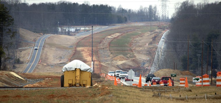 Image of US 220 widening construction progress for I-73, Lyn 
Hay Greensboro News Record, 2/1/14