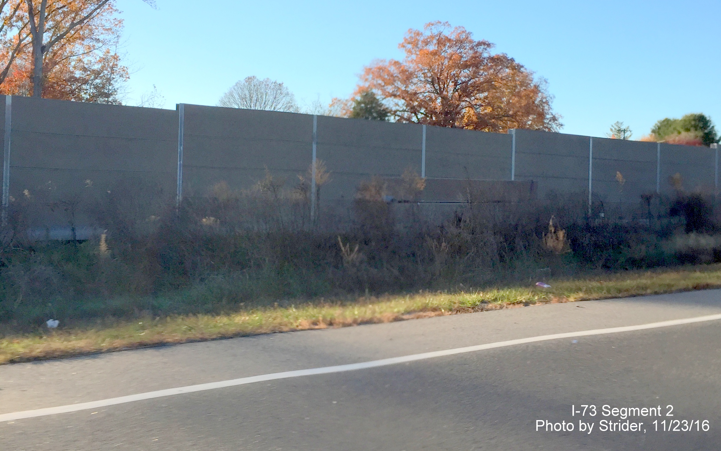 Image of noise barriers being built next to future I-73 Southbound lanes near interchange with NC 68 from US 220 North, by Strider