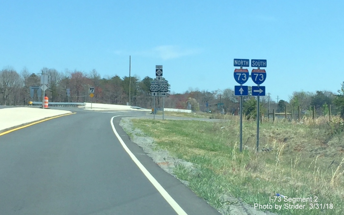 Image of I-73 trailblazers on NC 65 east approaching exit ramps to newly signed interstate, by Strider