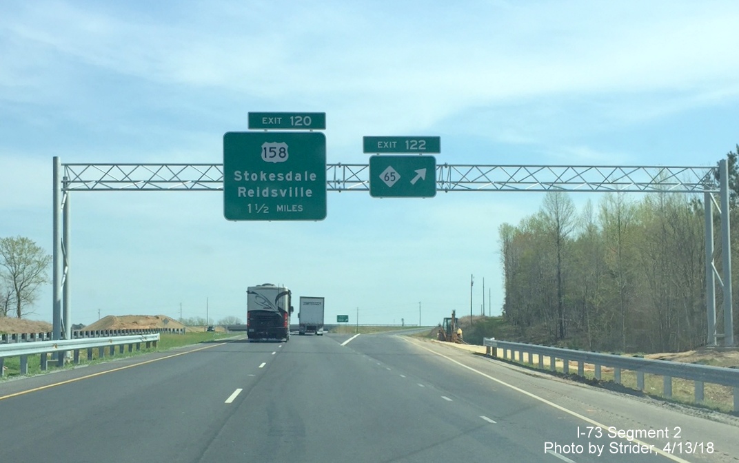 Image of previously placed overhead signage at NC 65 exit on I-73/US 220 South near Stokesdale now with exit number tabs, by Strider