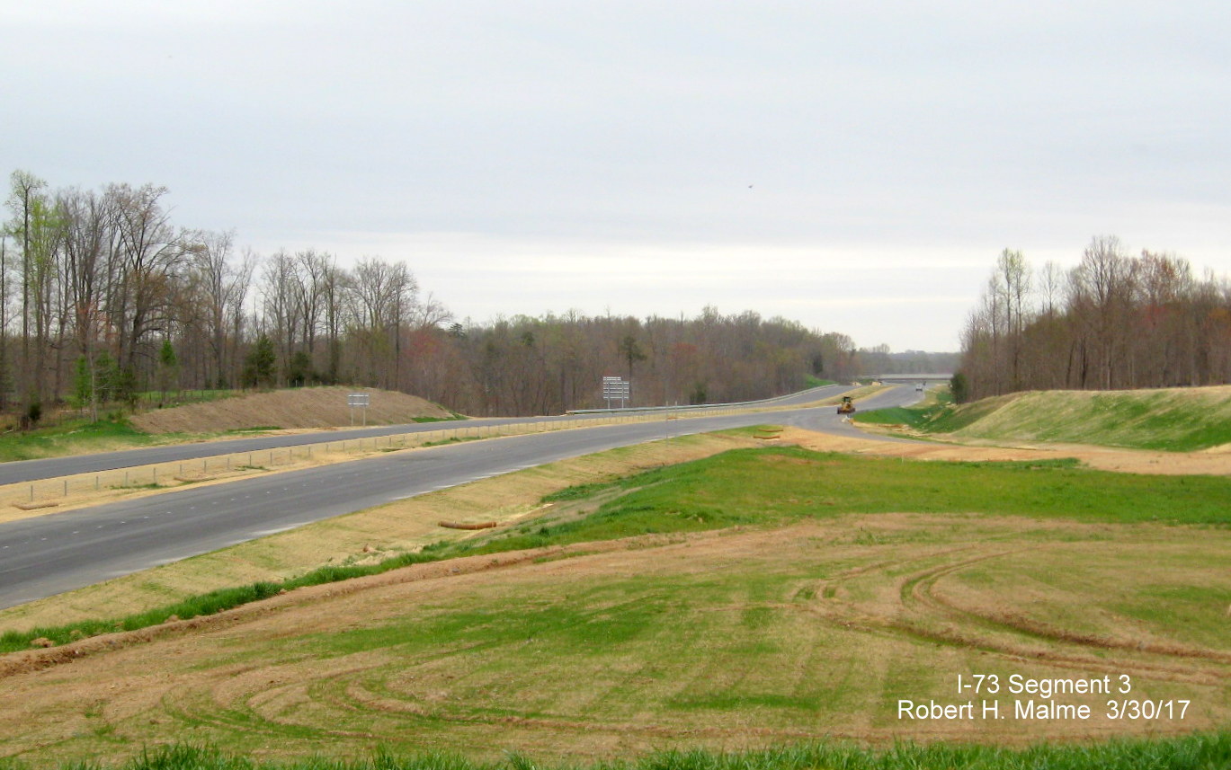 Image taken of view North of NC 150 bridge showing signs installed on future I-73 lanes in Guilford County