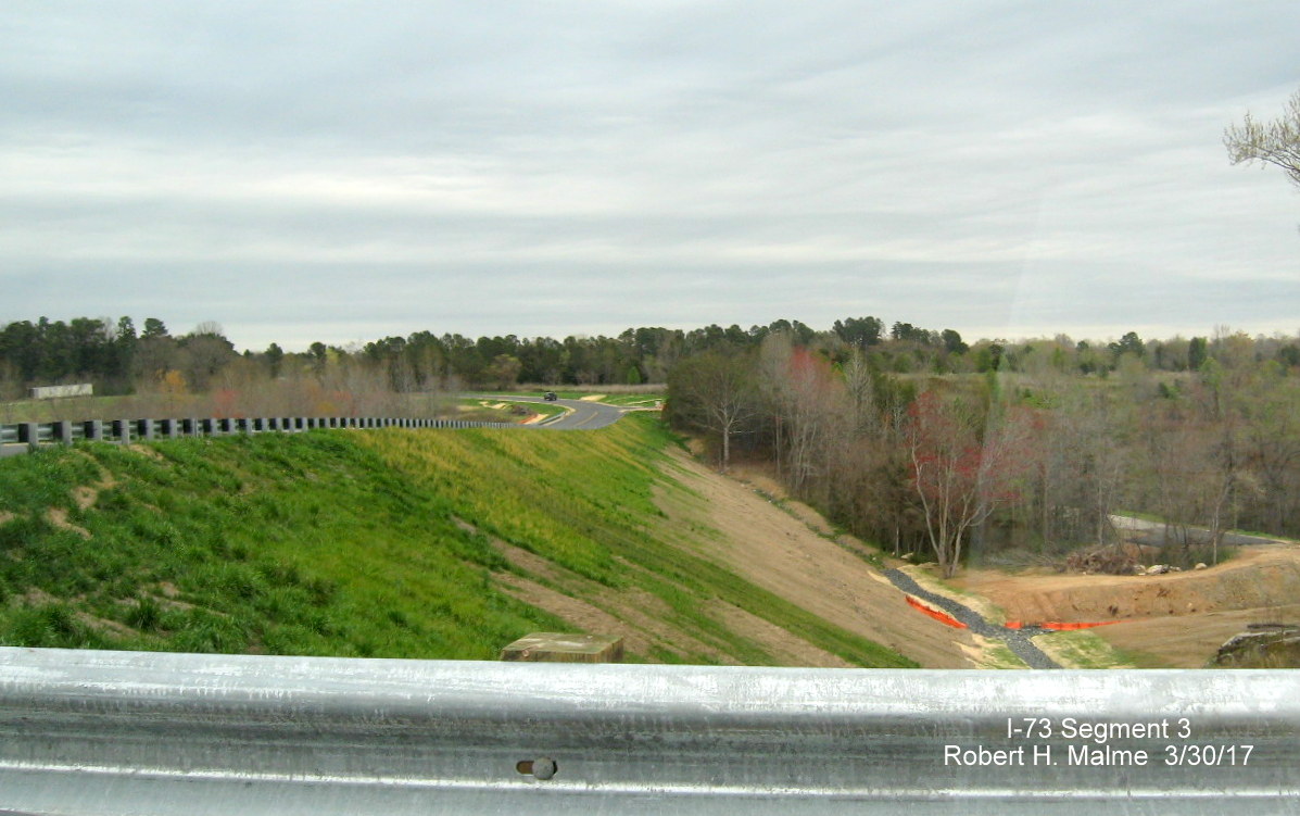 Image taken of view east of Brookbank Rd 150 bridge showing fill needed to get bridge over future I-73 lanes in Guilford County