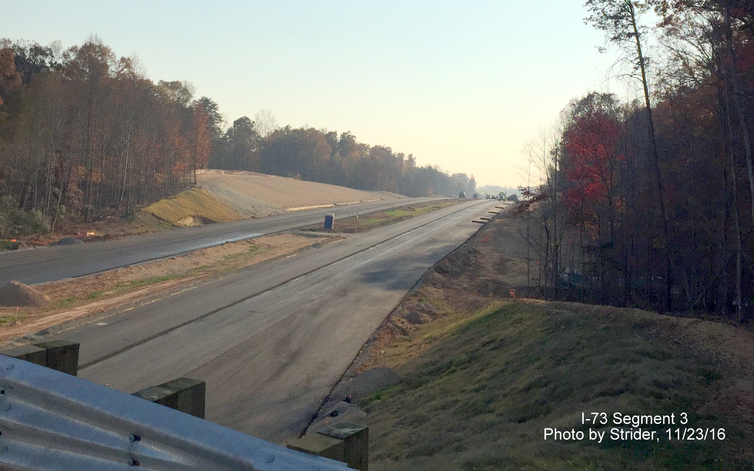 Image of view from Deboe Road looking south on toward NC 150 showing progress paving future I-73 lanes, from Strider