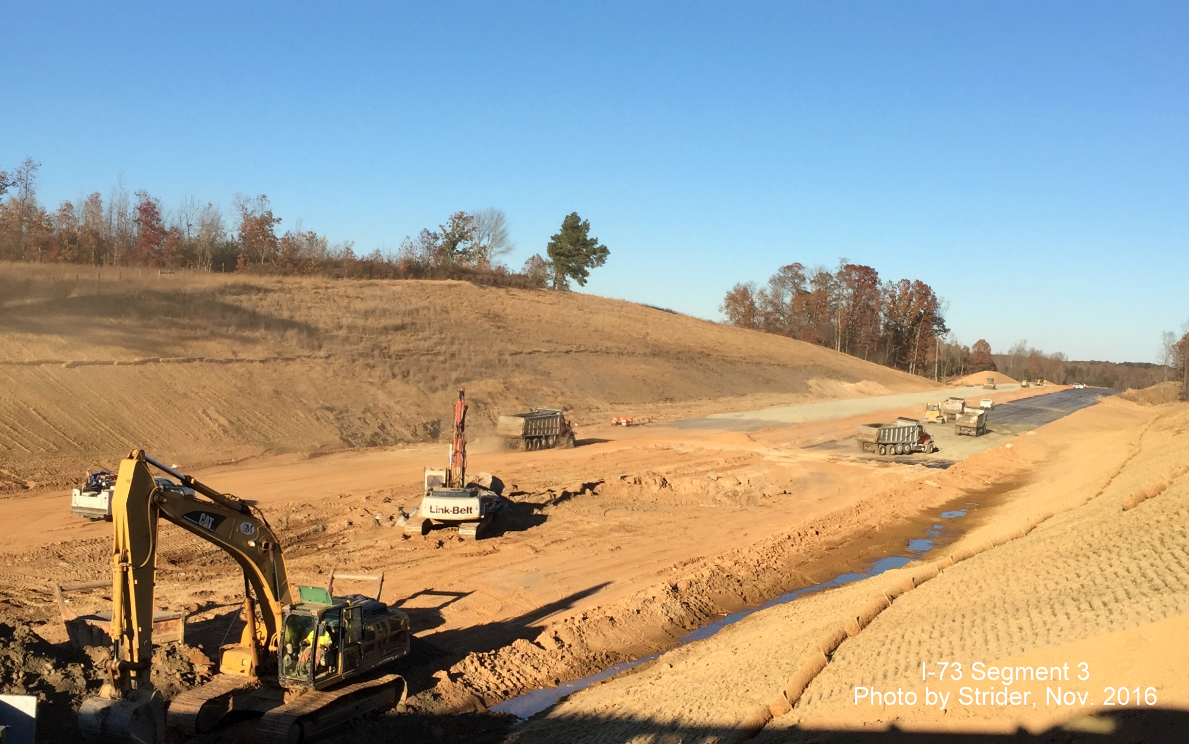 Image looking north from Bunch Road bridge showing progress constructing future lanes for I-73 near Summerfield, from Strider