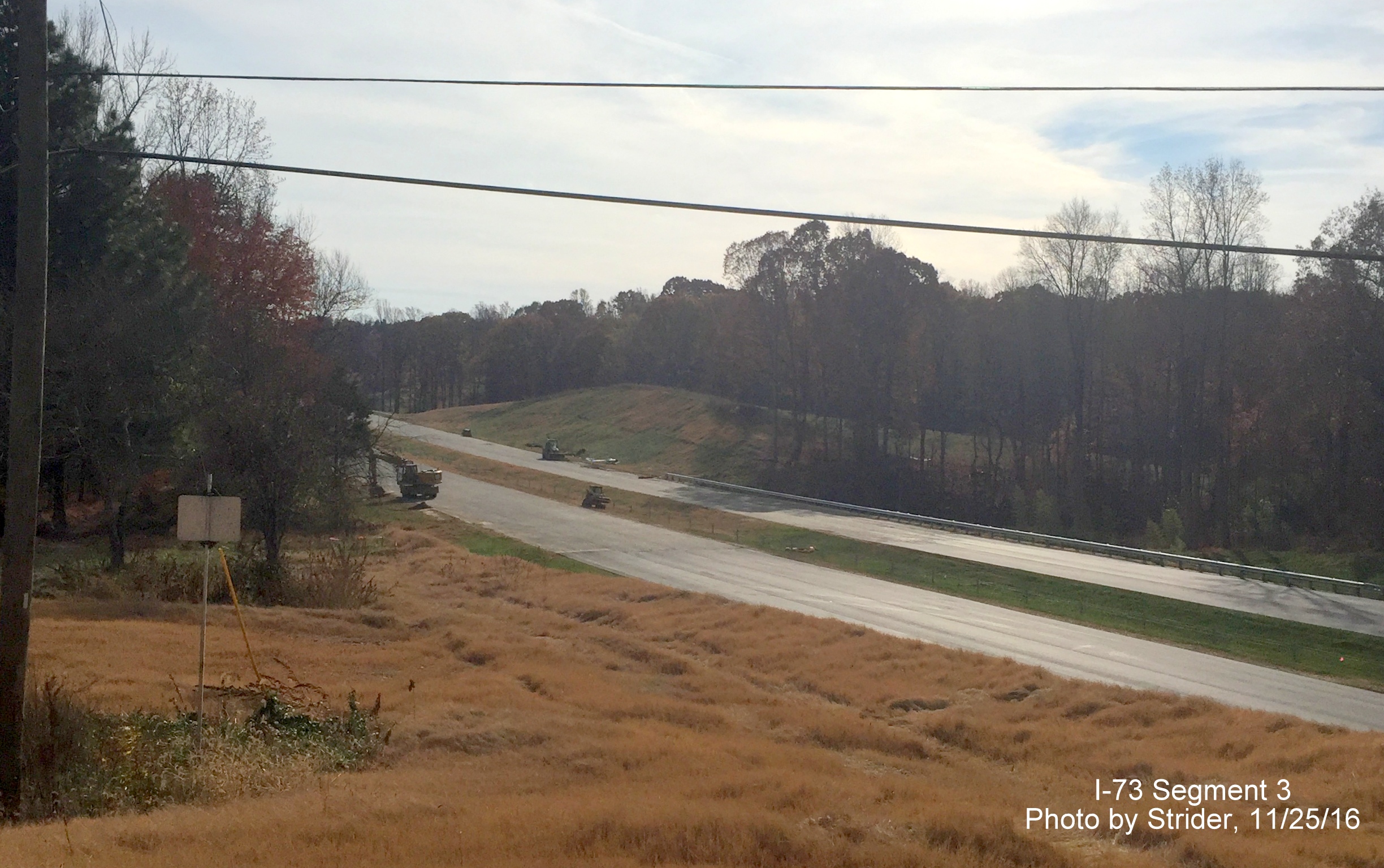 Image of view looking south from Alcorn Road showing paving progress on future I-73 lanes, from Strider
