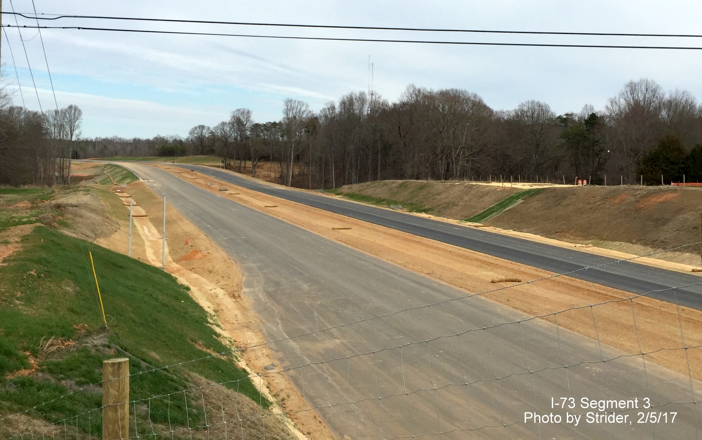 Image of view looking north from Deboe Rd showing progress paving future I-73 roadway, from Strider