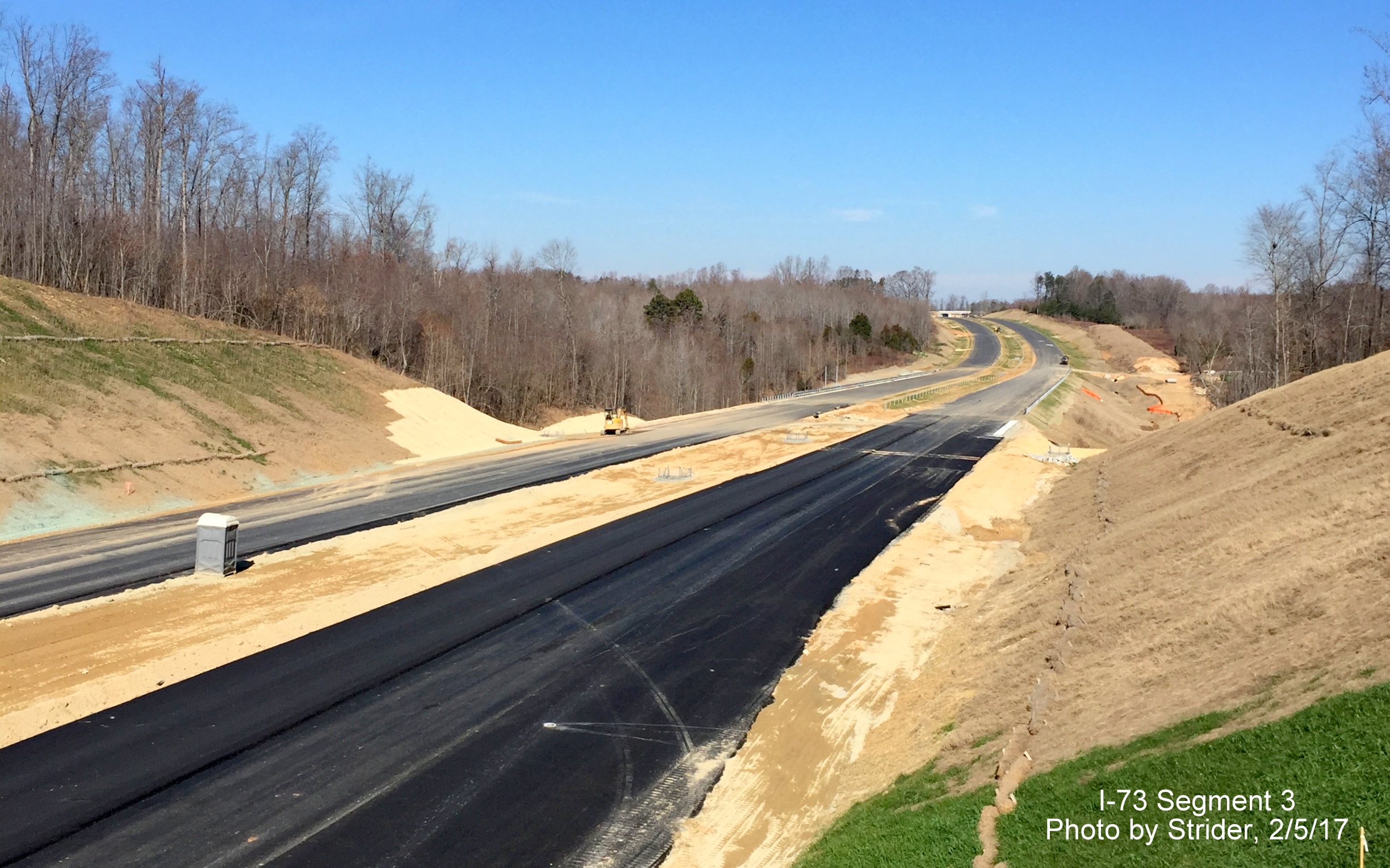 Image of view looking from Brookbank Rd bridge showign progress in paving future I-73 lanes, from Strider