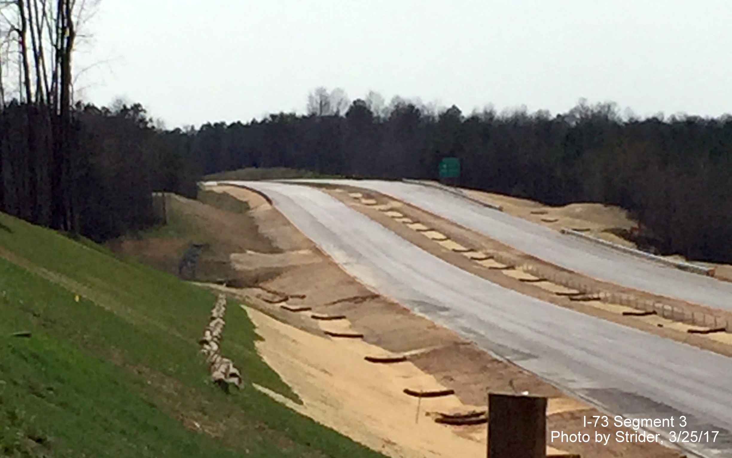 Image of view north from Bunch Rd bridge showing installation of new South US 220 exit sign, photo by Strider