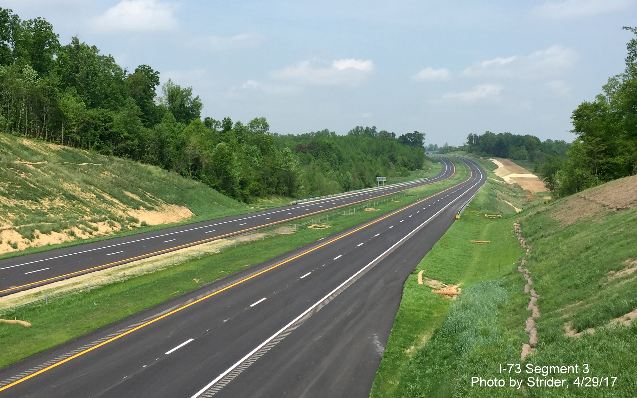 Image taken of view north of Brookbank Rd bridge of nearly completed Future I-73 roadway, by Strider