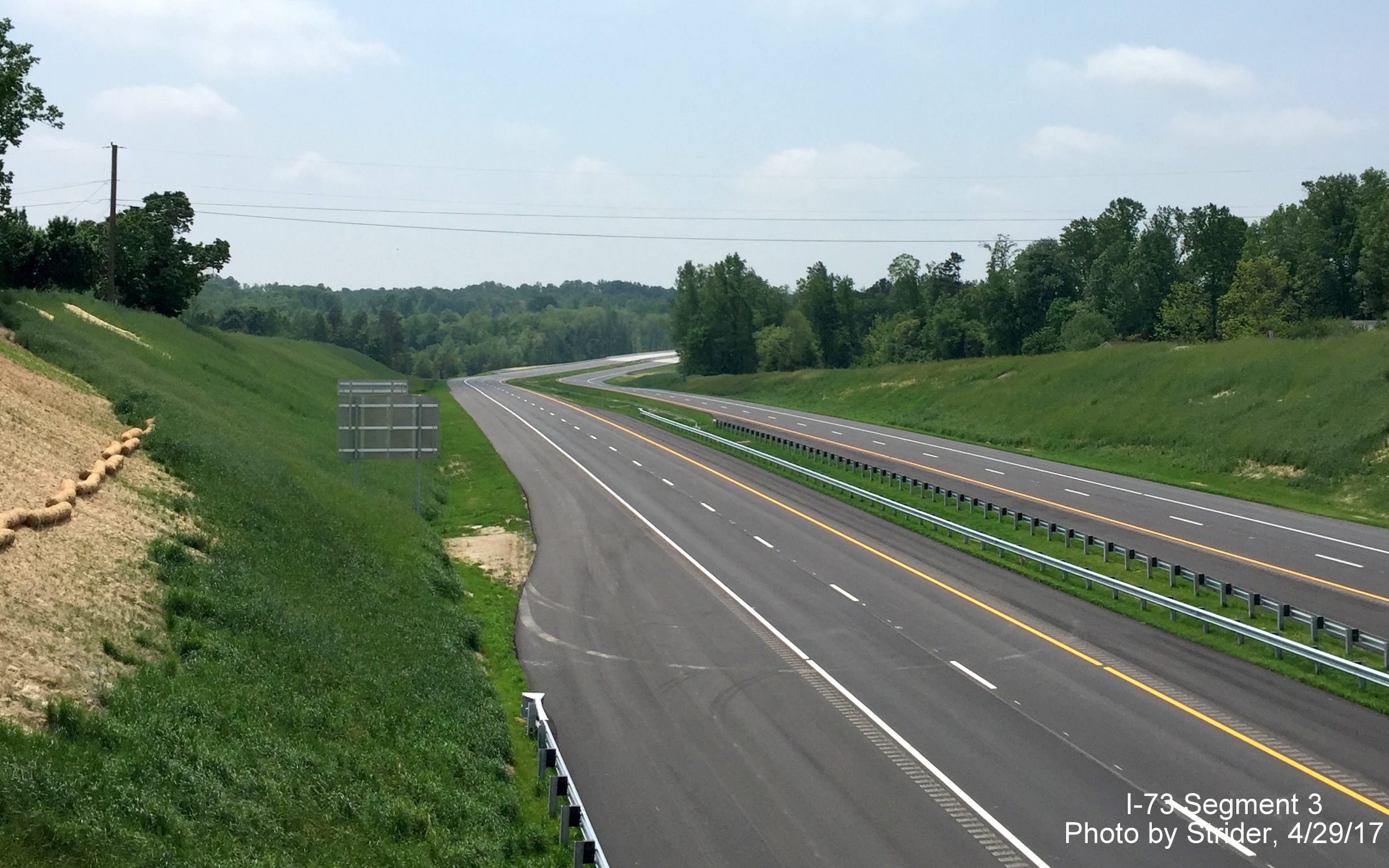 Image taken of view south of Brookbank Rd bridge of nearly completed Future I-73 roadway, by Strider
