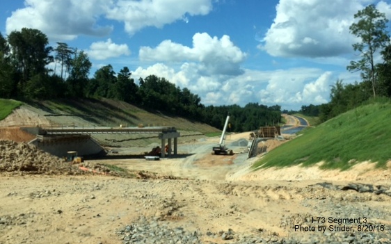 Image of Brookbank Road overpass under construction over future I-73 roadway, from Strider