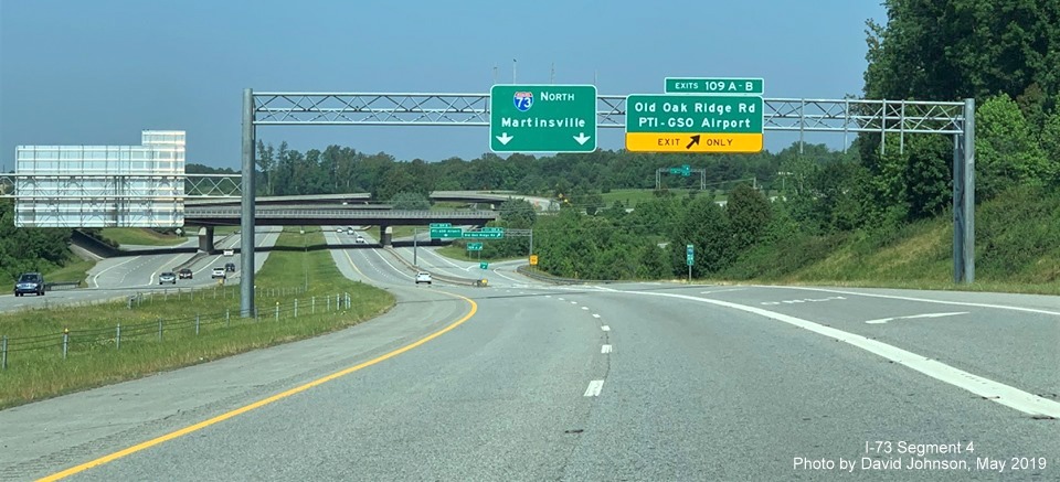 Image of overhead signage for Old Oak Ridge Rd/PTI Airport exit on I-73 North after on-ramp from Old Oak Ridge Rd, by David Johnson