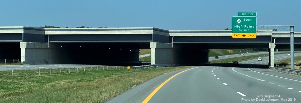 Image of PTI taxiway bridge over I-73 North after 1/2 mile advance overhead sign for NC 150 South exit on I-73 North in Greensboro, by David Johnson