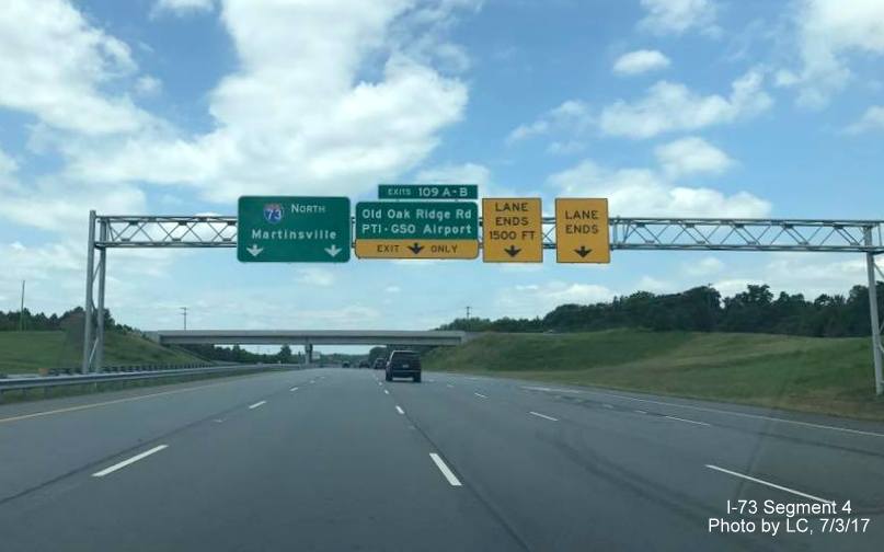 Image of overhead signs after PTI Airport exit on-ramp to I-73 North in Greensboro, by LC
