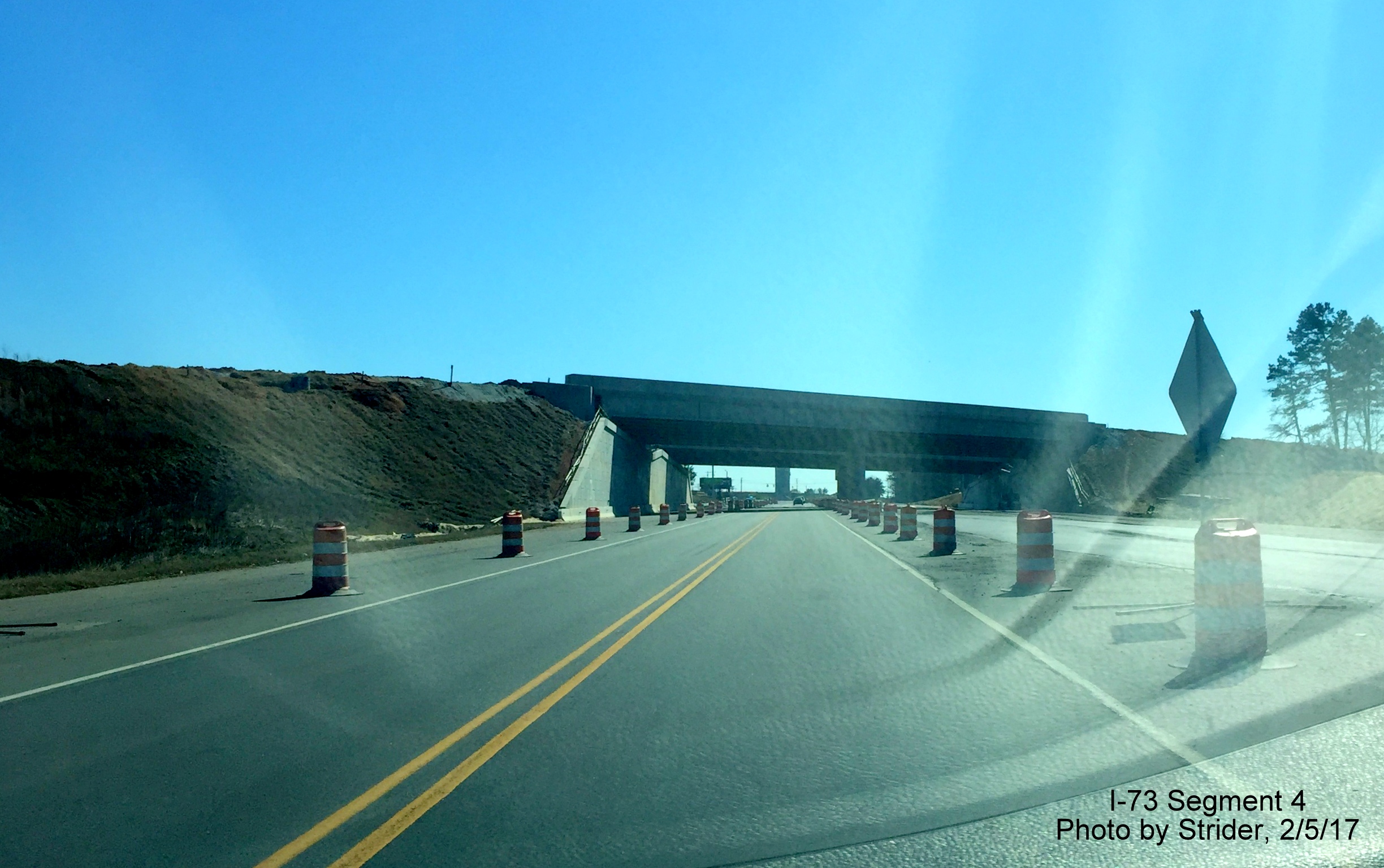 Image of view along NC 68 South at northern I-73 bridges showing progress in constructing spans, from Strider 