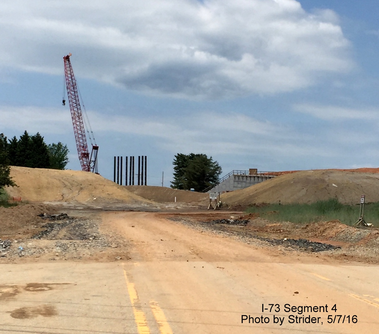 View from dead end of Regional Rd, showing equipment used for taxiway construction over Future I-73 lanes, from Strider
