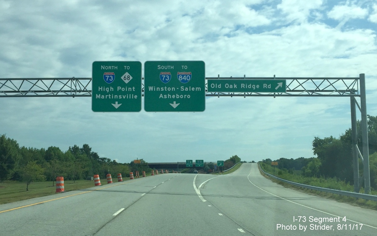 Image of overhead signage for I-73 and Old Oak Ridge Rd leaving PTI Airport, by Strider