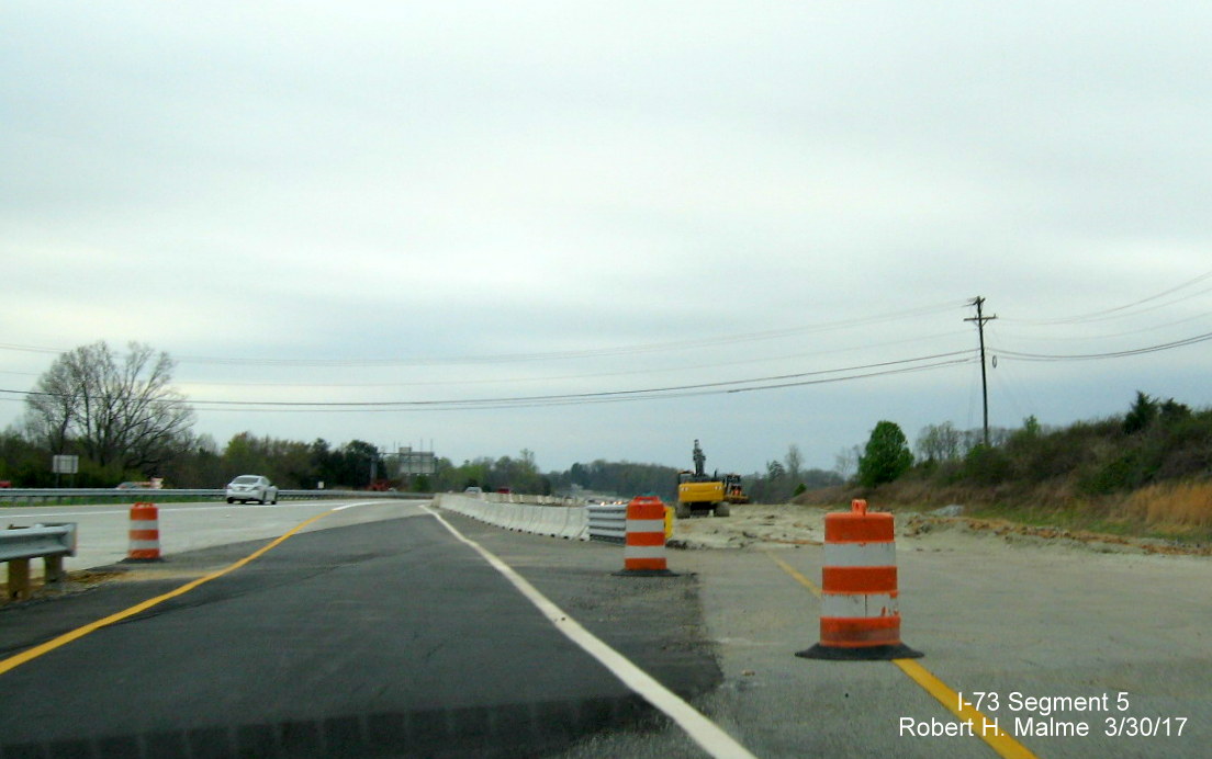 Image of view along Greensboro Outerp Loop heading south after Bryan Blvd exit showing I-73 ramp construction