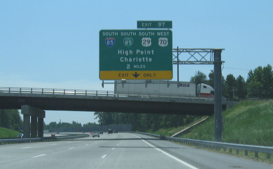 Photo of I-73 Greensboro Loop exit signs for I-85 and Bus. 85, June 2009