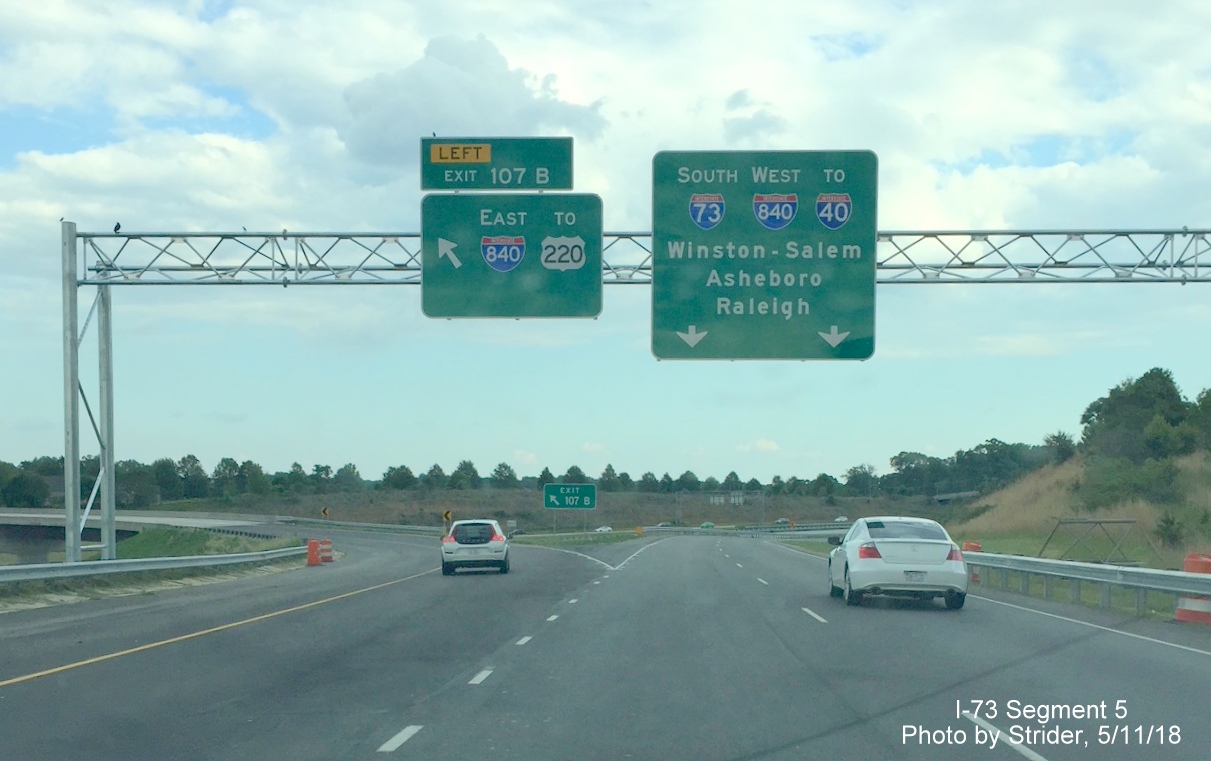 Image of newly placed overhead signage on ramp from Bryan Blvd showing new I-73 and I-840 designations at ramp split before joining
    the Greensboro Urban Loop, by Strider