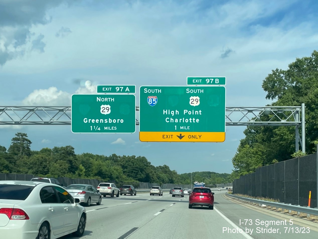 Image of removed Business 85 and US 70 shields from advance signage approaching the I-85/US 29 interchange 
        on I-73/US 421 South, photo by Strider, July 2023