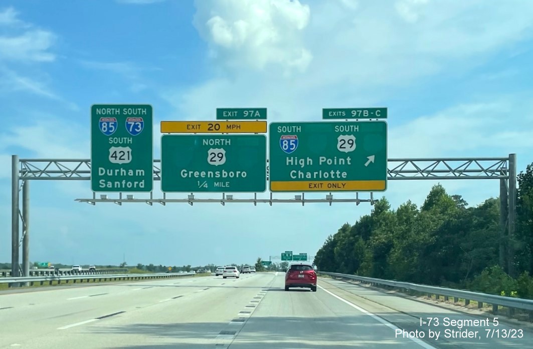 Image of removed Business 85 and US 70 shields from exit signage at the I-85/US 29 interchange 
        on I-73/US 421 South, photo by Strider, July 2023