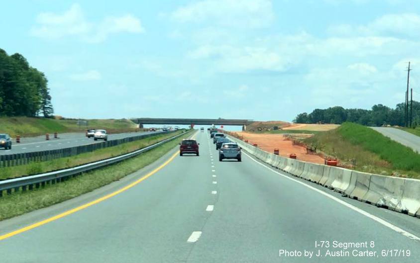 Image of construction of exit ramp from I-73 South/I-74 East to future US 64 Asheboro Bypass, by J. Austin Carter