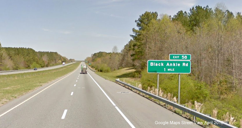 Google Maps Street View image of 1-mile advance sign for Black Ankle Road exit on 
        I-73/US 220 North, I-74 West in April 2018