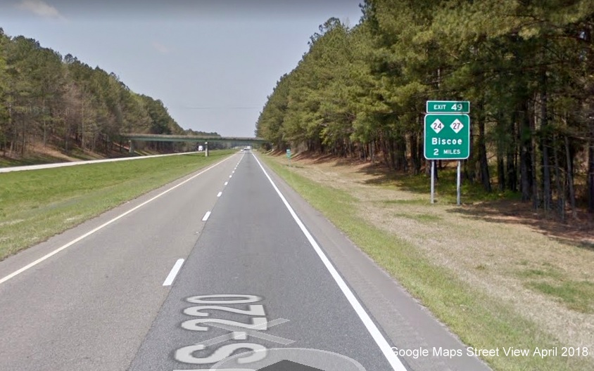 Google Map Street View image of ground-mounted 1-mile advance sign for NC 24/27 exit on 
        I-73/US 220 North, I-74 West in April 2018