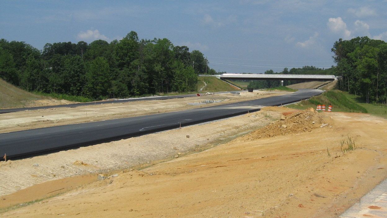 View of I-74 freeway showing progress on laying pavement for the future 
roadway, June 2010
