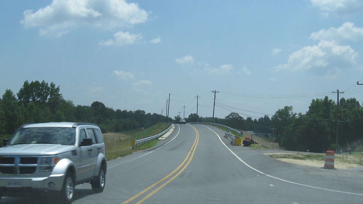 Photo of completed NC 62 bridge showing landscaping work in June 2010