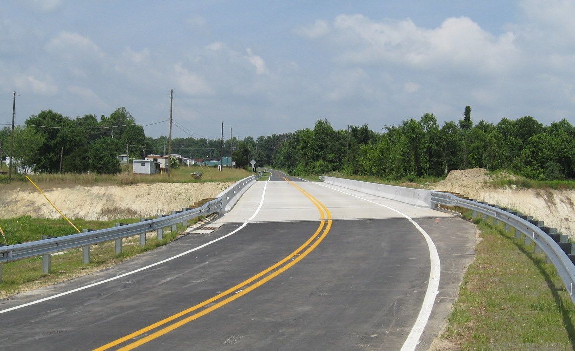 Photo of completed Poole Road Bridge heading west over I-74 still under 
construction