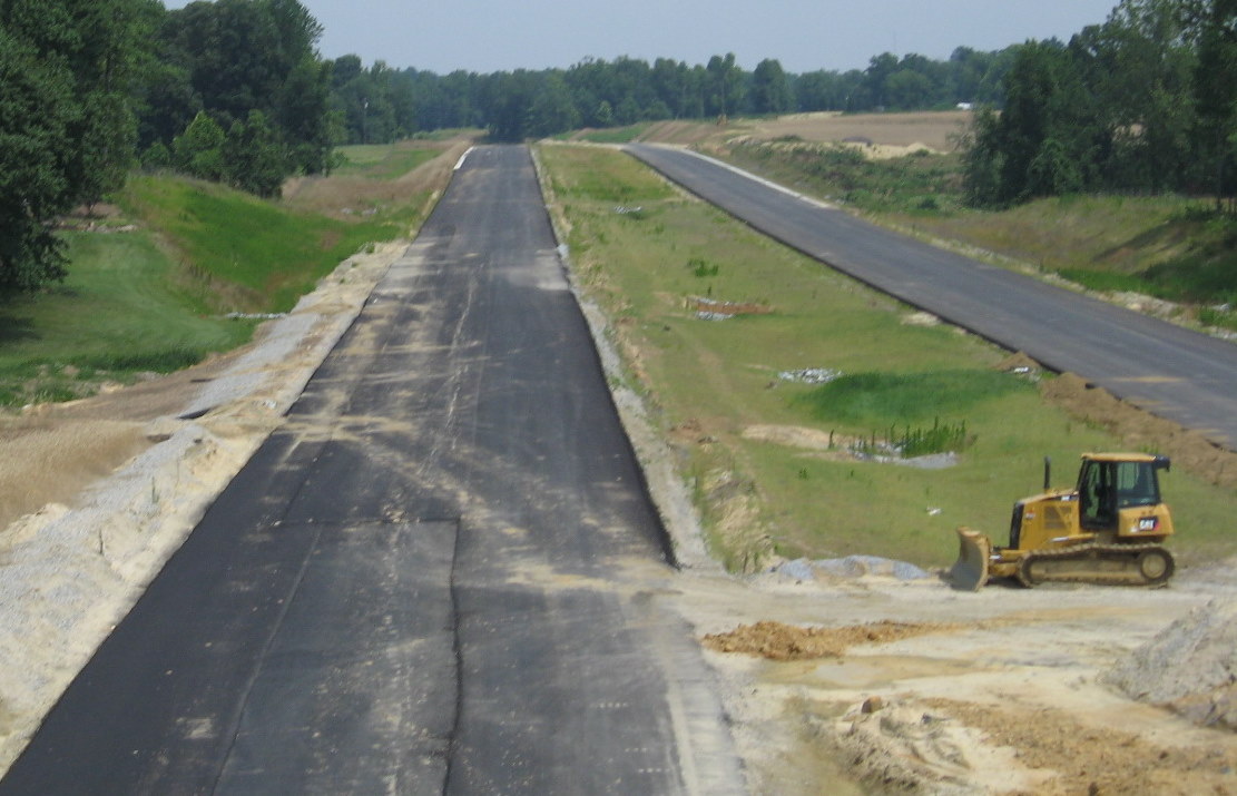 Photo of view west/north from Tuttle Rd Bridge showing I-74 construction 
progress in June 2009