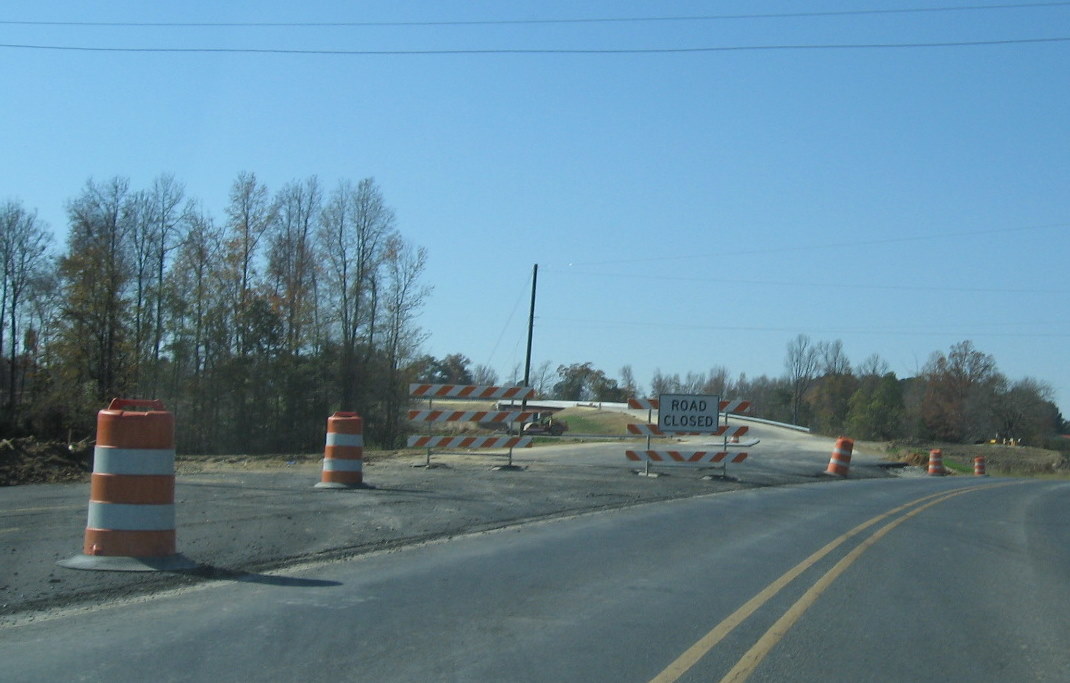 Photo showing the near completion of the connection between the new portion 
of Cedar Square Rd with the old alignment, Nov. 2009