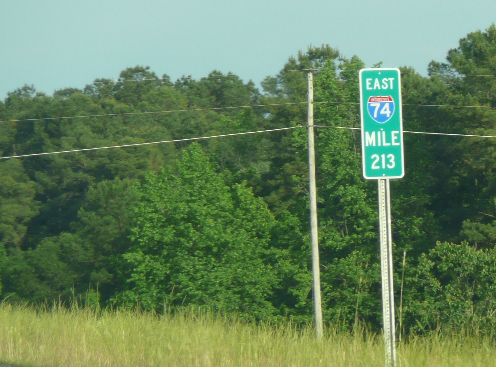 Photo of I-74 mile markers with I shield between exits 210 and 213, May 
2009