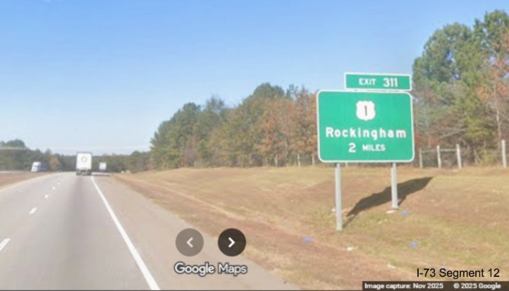 Image of new ground mounted 2 Miles advance sign for US 1 exit on I-74/US 74 West
in Rockingham, Google Maps Street View, November 2025