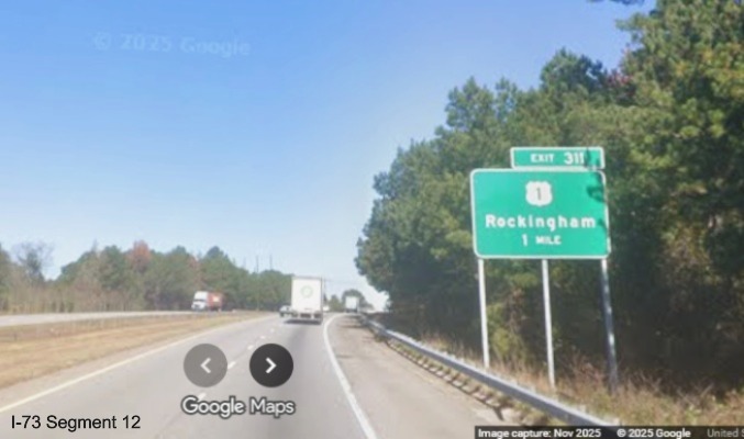 Image of new ground mounted 1 Mile advance sign for US 1 exit on I-74/US 74 West
in Rockingham, Google Maps Street View, November 2025