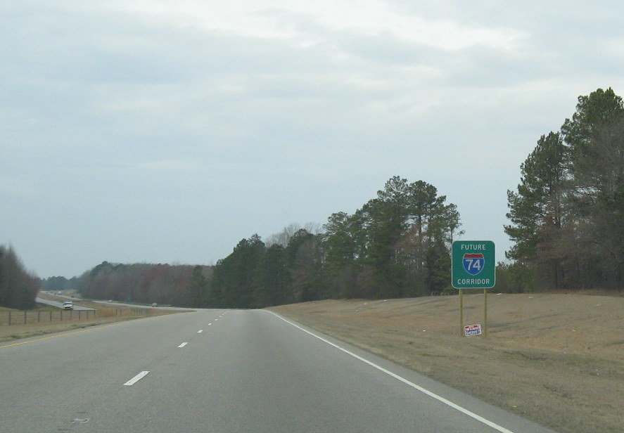 Photo of newly placed Future I-74 Corridor sign at west end of Maxton Bypass, 
March 2010