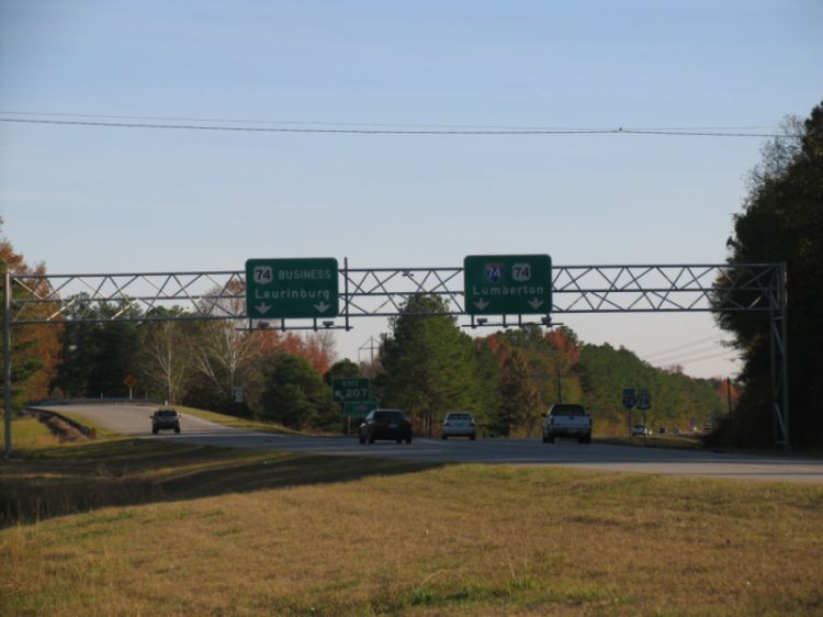 Photo of the first overhead signs for the Laurinburg Bypass showing
I-74 shields in Dec. 2007, courtesy of Adam Prince