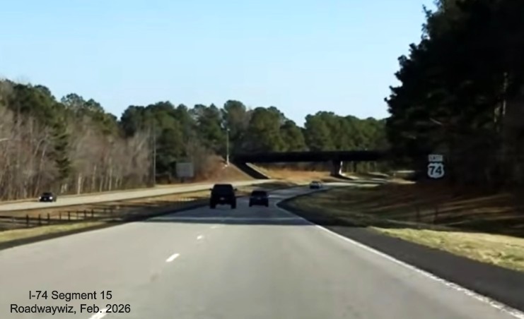 Image of newly paved shoulders on both sides of US 74 (Future I-74) East in 
	  Maxton approaching reassurance marker, screen grab from Roadwaywiz video, February 2026
