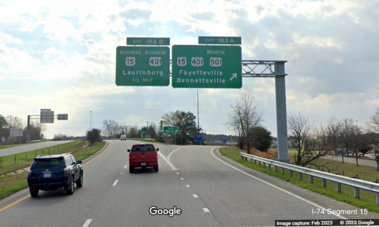 Image of new overhead signage at ramp for US 15/401/US 501 North exit on US 74 (Future I-74) East 
        in Laurinburg, Google Maps Street View, February 2023