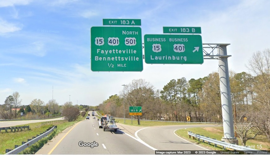 Image of new overhead signs at ramp for Business US 15/401 exit on US 74 (Future I-74) West 
        in Laurinburg, Google Maps Street View, March 2023