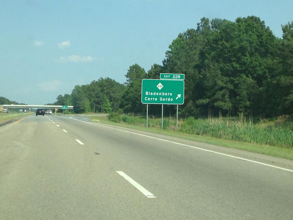 Photo of sign for NC 242 Exit on US 74 (Future I-74) East in
Columbus County. Photo courtesy of Chris Curley